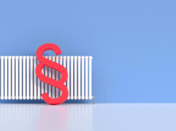 Paragraph sign is leaning on a radiator